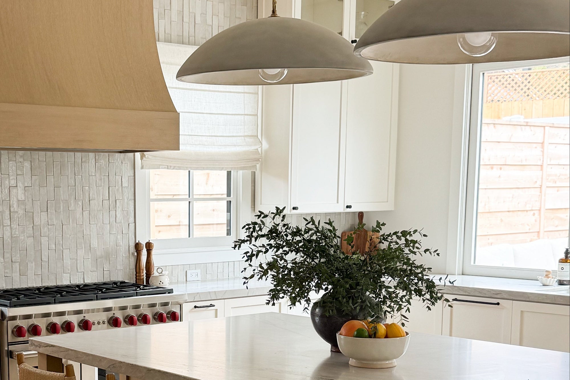 Modern kitchen with an island and bar stools. Vance Design Co Interior Designer